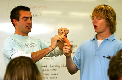 Facts of life: Bundoora Secondary College teacher Dan Carrol shows students how to use a condom.